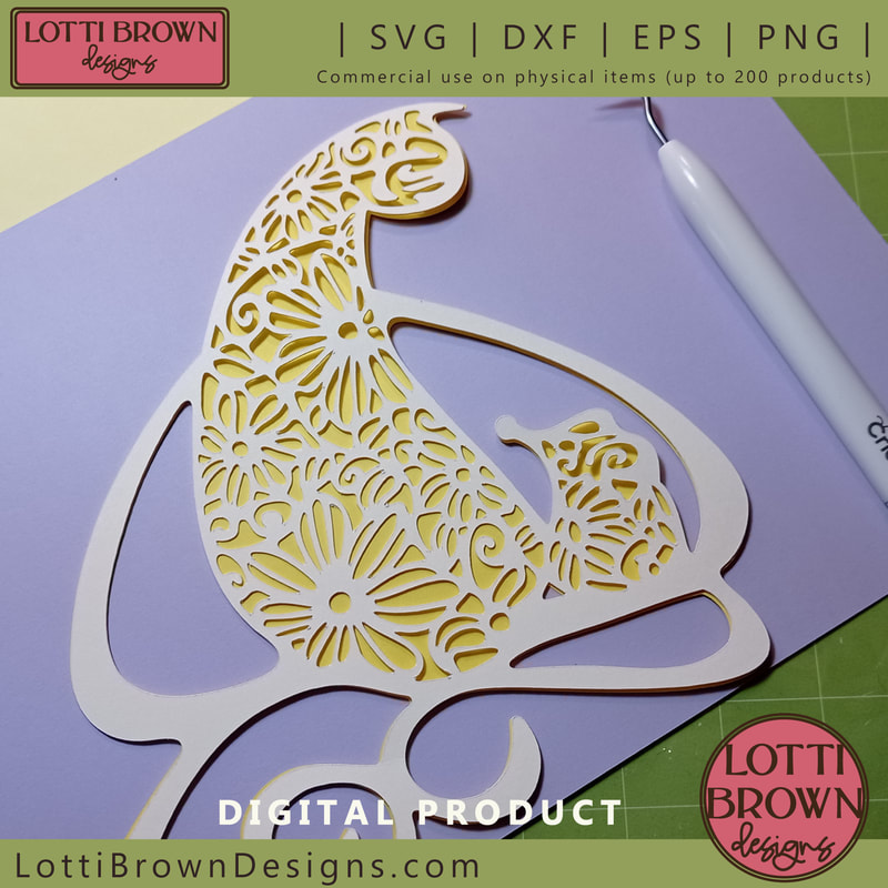 Floral cat and mouse papercut design