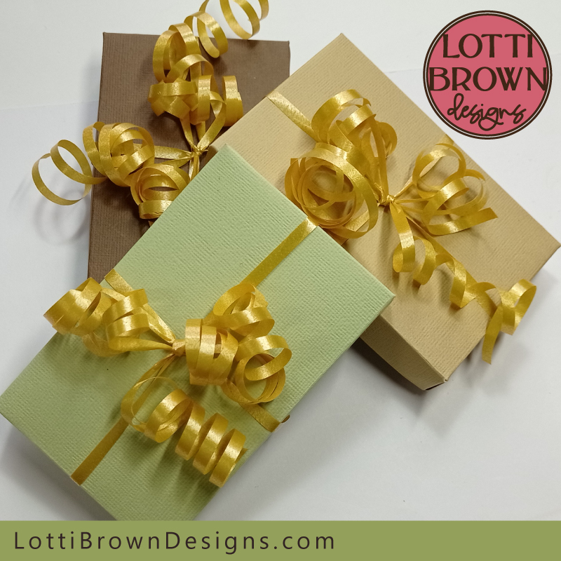 Present your gift card box with a curled florists ribbon to make it look extra special