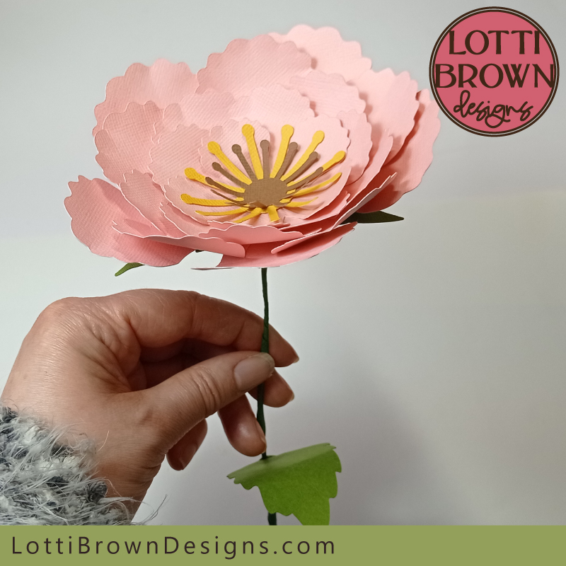 Learn how to add a stem to your paper flower - easily add a stem to your flower template with no hot glue required...