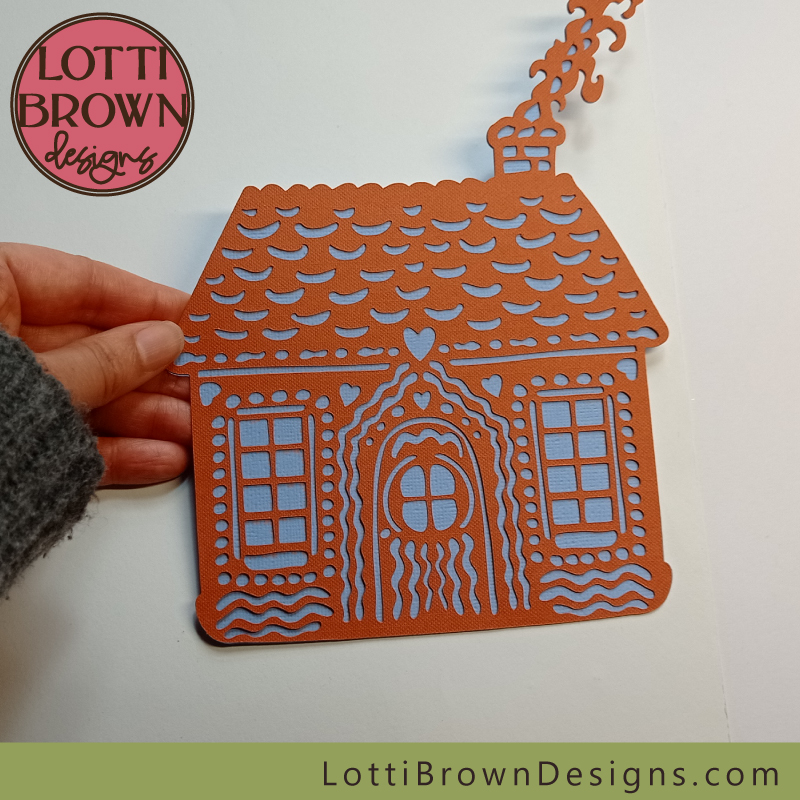 Orange and blue gingerbread house cardstock creation made with Cricut