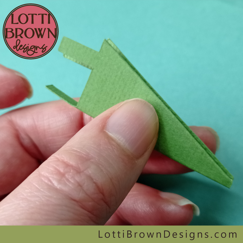 Squeeze the bottom edge to make the fold