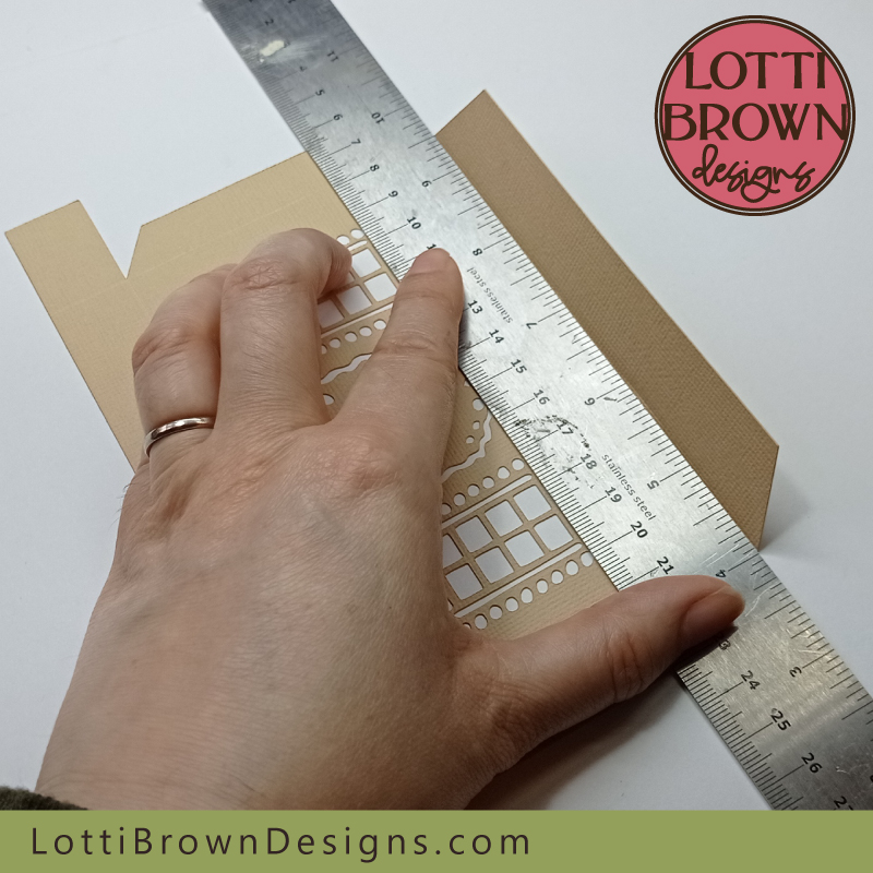 Fold up each of the flaps along the score lines using the metal rule