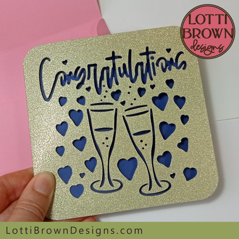 Champagne glasses and hearts engagement card SVG file