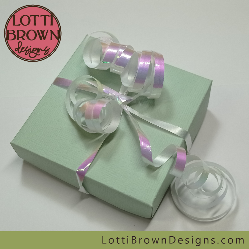 Present your gift box with some curled florists ribbon