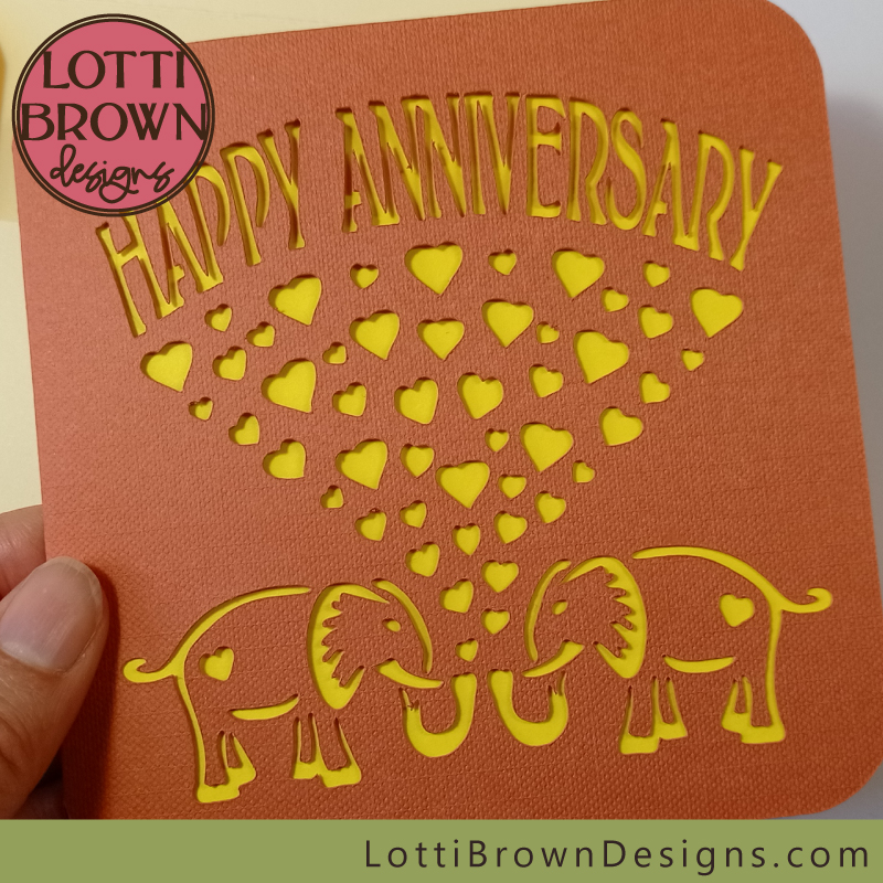 Papercut anniversary card in orange/rust and yellow
