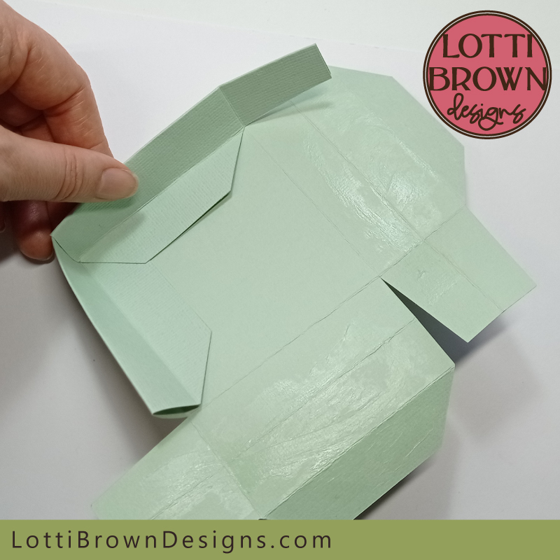 Folding to complete the second side of the box