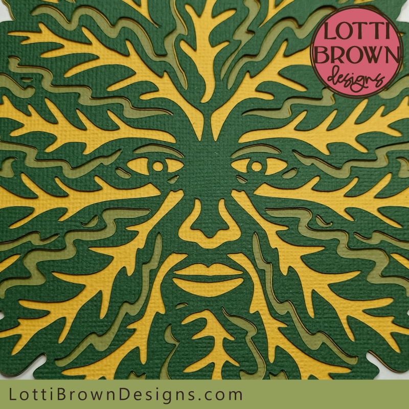 Green Man papercut close up