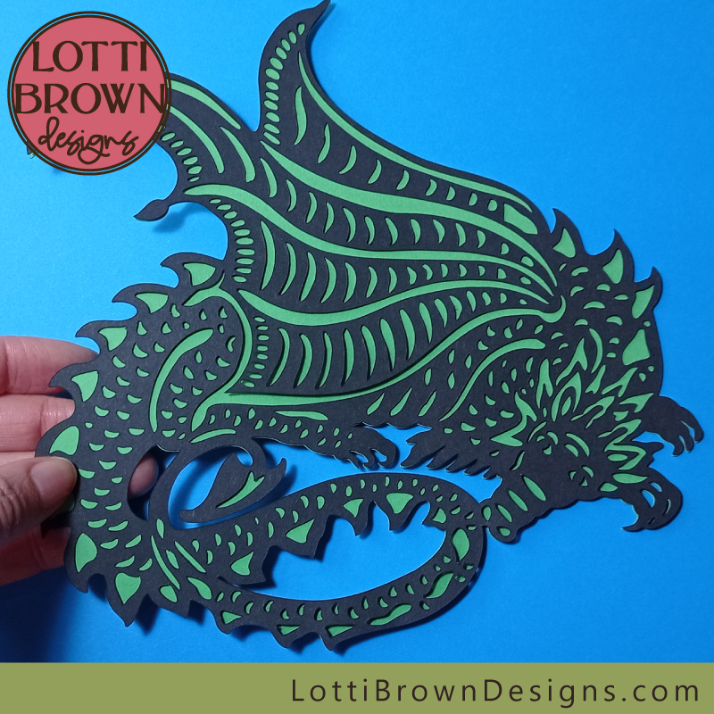 Sleeping dragon papercut in black and green card